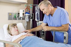 Doctor Talking To Senior Woman