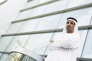 Businessman standing outdoors by building