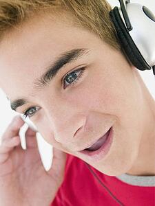 Teenage boy wearing headphones