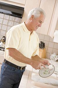 Man Cleaning Dishes 