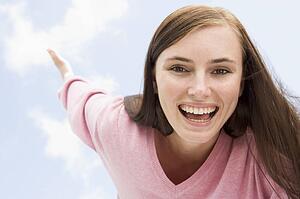 Woman in a pink sweater posing