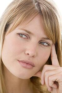 Head shot of woman thinking