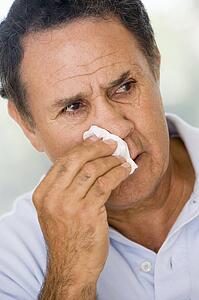 Man Blowing His Nose