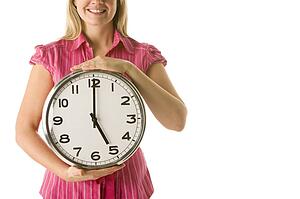 Woman Holding Clock