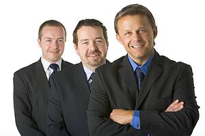 Group Of Businessmen Smiling 