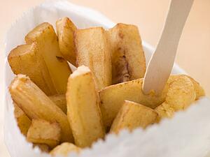 Chip Shop Chips in a Bag with a Wooden Fork