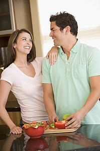 Husband And Wife Preparing meal, mealtime Together