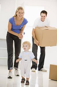Family moving into new home smiling