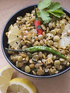 Bowl of Green Lentils cooked with Sliced Lemon Chili and Coriander
