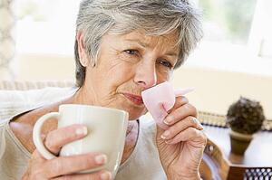 Woman Blowing Her Nose