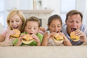 Family Eating Cheeseburgers Together