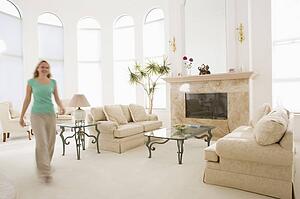 Woman walking through living room