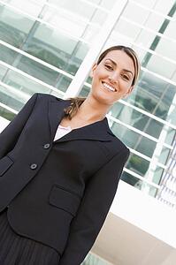 Businesswoman standing outdoors smiling