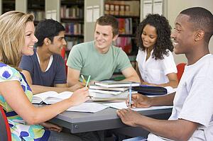 Five people in library studying (selective focus)
