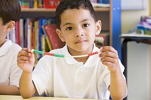 Student in math class with counting beads
