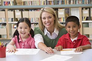 Two students in class with teacher