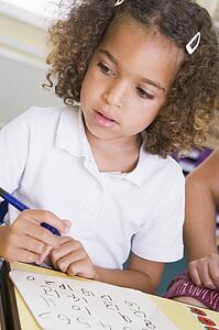 Student in class learning numbers (selective focus)
