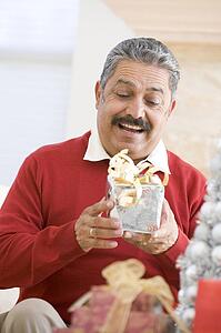 Man Excited To Open Christmas Present