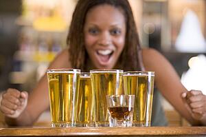 Woman posing with several beer glasses
