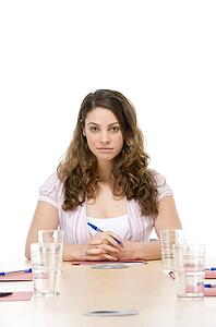 Businesswoman sitting in boardroom