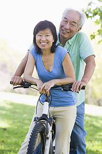 Mature couple bike riding.