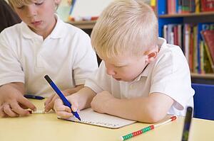 Students in class learning numbers (selective focus)
