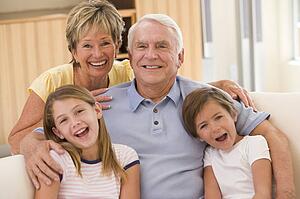 Grandparents posing with grandchildren.