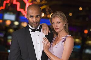 Couple in casino with cigar (selective focus)