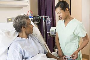 Nurse Talking To Senior Woman