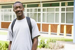 Student standing outdoors smiling