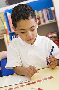 Student in class learning numbers (selective focus)
