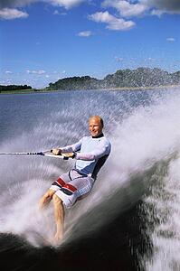 Man waterskiing barefoot