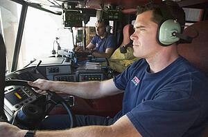 Two firemen in fire engine