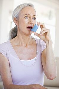 Woman Using An Inhaler
