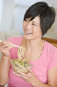 Women Eating meal, mealtime With Chopsticks 