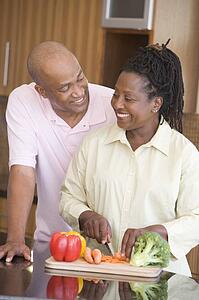 Husband And Wife Preparing A meal, mealtime Together
