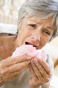 Woman Blowing Her Nose