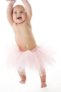 Baby standing in tutu