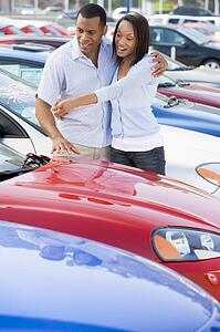 Young couple shopping for a new car