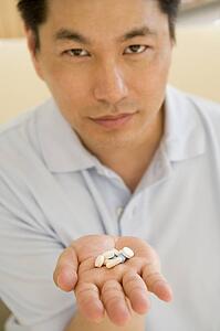 Man Taking Pills