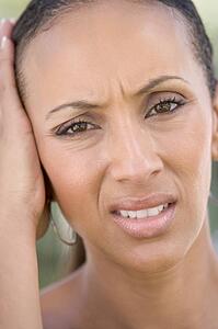 Head shot of woman scowling