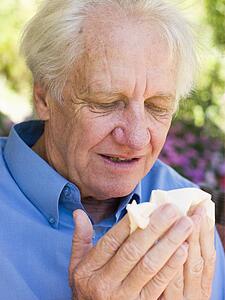 Man Blowing His Nose