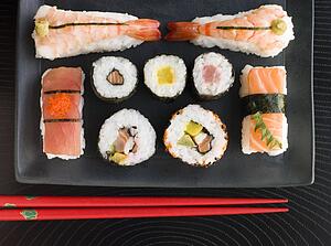 Selection of Seafood And Vegetable Sushi With Chopsticks (Overhead)