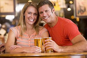 Couple having beer together