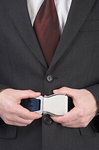Businessman Fastening Safety Belt