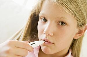 Girl Having Her Temperature Measured