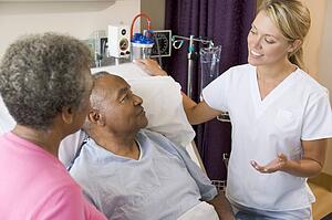 Doctor Explaining To Senior Couple