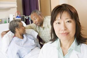 Nurse Standing In Hospital Room