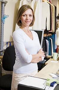 Woman at clothing store smiling