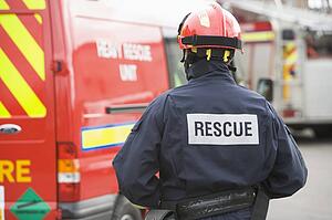 Rescue worker walking back to rescue vehicle